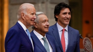 U.S. President Joe Biden, Mexican President Andres Manuel Lopez Obrador, and Canadian Prime Minister Justin Trudeau pose for a photo as they participate in a news conference at the 10th North American Leaders' Summit at the National Palace in Mexico City, Tuesday, Jan. 10, 2023. (AP Photo/Andrew Harnik) 