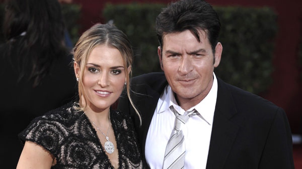 In this Sept. 20, 2009, file photo, actor Charlie Sheen, right, and his wife Brooke Mueller arrive at the 61st Primetime Emmy Awards in Los Angeles. (AP Photo/Chris Pizzello, file)