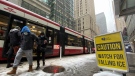 Passengers step off a streetcar during a snowy day in Toronto on Tuesday, Nov.15, 2022. THE CANADIAN PRESS/Graeme Roy