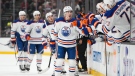 Edmonton Oilers' Ryan Nugent-Hopkins (93) is congratulated for his goal during the first period of the team's NHL hockey game against the Anaheim Ducks on Wednesday, Jan. 11, 2023, in Anaheim, Calif. (AP Photo/Jae C. Hong)