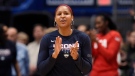 In this Jan. 27, 2020, file photo, former Connecticut and Minnesota Lynx player Maya Moore applauds in Hartford, Conn. (AP Photo/Jessica Hill, File)