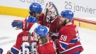 Montreal Canadiens goaltender Sam Montembeault, centre, celebrates with teammates after defeating the Winnipeg Jets in an NHL hockey game in Montreal, Tuesday, January 17, 2023. THE CANADIAN PRESS/Graham Hughes