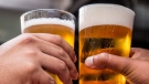 Stock image of beer glasses clinking. (Pexels, Tembela Bohle)
