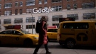 In this Dec. 17, 2018, file photo a woman walks past Google offices in New York. Google's parent Alphabet Inc. is eliminating about 12,000 jobs, or 6 per cent of its workforce, it said Friday. (AP Photo/Mark Lennihan, File)