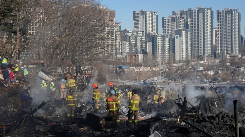 Fire burns makeshift homes in shadow of Seoul's skyscrapers