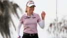 Brook Henderson waves to the gallery after sinking a birdie putt on the 18th green during the first round of the LPGA Hilton Grand Vacations Tournament of Champions Thursday, Jan. 19, 2023, in Orlando, Fla. (AP Photo/John Raoux)
