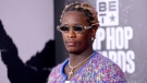 Grammy-winning rapper Young Thug and a racketeering co-defendant conducted a hand-to-hand drug transaction during a court hearing, prosecutors said in a motion filed in Atlanta. (Paras Griffin/Getty Images)