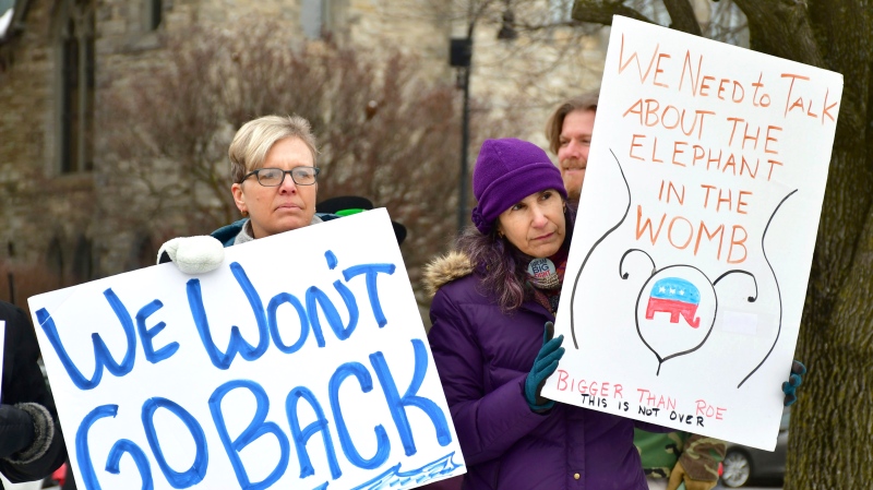 'Here again': Abortion activists rally 50 years after Roe