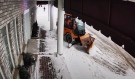 Chantelle Gorham captured video of a city sidewalk plow knocking over a community box in Levack that serves as a food pantry and lending library on Tuesday morning and dragging it down the road before leaving it. (Photo from video)