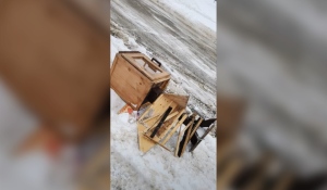 Chantelle Gorham captured video of a city sidewalk plow knocking over a community box in Levack that serves as a food pantry and lending library on Tuesday morning and dragging it down the road before leaving it. (Photo from video)