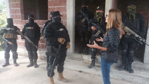 W5's Avery Haines talks with a leader of a Mexican cartel, surrounded by armed guards.