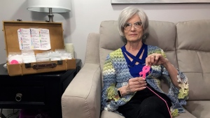 Marielle Dionne holds a cancer ribbon keychain she crocheted. (Stefanie Davis/CTV News) 