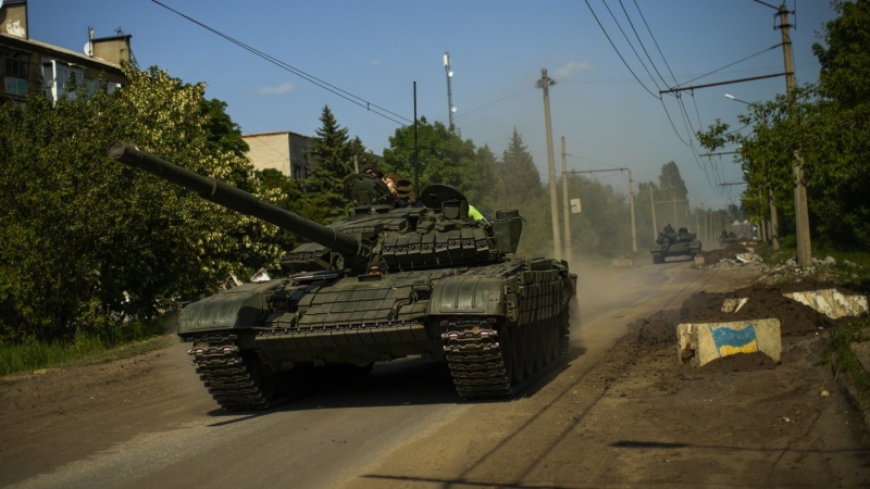 Ukrainian tanks move in Donetsk region, eastern Ukraine, Monday, May 30, 2022. The West's move to send tanks to Ukraine was greeted enthusiastically from Kyiv, Berlin and Washington. But Moscow seemed to shrug. The Kremlin has warned the West that supplying tanks would be a dangerous escalation of the conflict and denounced the decision. (AP Photo/Francisco Seco, File)
