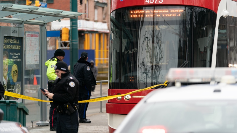 Police cars surround a TTC streetcar on Spadina Ave., in Toronto on Tuesday, January 24, 2023. Police say a person was stabbed multiple times on a Toronto streetcar. They say the victim was sent to hospital and a suspect was arrested at the scene. THE CANADIAN PRESS/Arlyn McAdorey