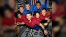 This undated photo released in June 2003 provided by NASA shows STS-107 crew members aboard the Space Shuttle Columbia. On Feb. 1, 2003, the seven crew members were lost as the Columbia fell apart over East Texas. This picture was on a roll of unprocessed film later recovered by searchers from the debris. From the left (bottom row), wearing red shirts to signify their shift's color, are mission specialist Kalpana Chawla, commander, Rick D. Husband, mission commander Laurel B. Clark and Ilan Ramon, payload specialist. From the left (top row), wearing blue shirts, are mission specialist David M. Brown, pilot William C. McCool, pilot; and payload commander Michael P. Anderson. (NASA via AP, File)