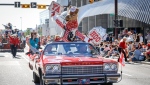 Stampede mascot Harry the Horse gets the crowd cheering at the start of the Calgary Stampede parade in Calgary, Friday, July 8, 2022. (THE CANADIAN PRESS/Jeff McIntosh)