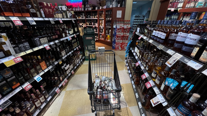 A person's purchases are seen in a shopping cart at a government-run BC Liquor Store in Vancouver, on Friday, August 19, 2022. THE CANADIAN PRESS/Darryl Dyck