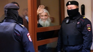 Nikolai Romanov, a former monk known as Father Sergiy until he was excommunicated by the Russian Orthodox Church, during his trial in Moscow, Russia, on Jan. 27, 2023. (Alexander Zemlianichenko / AP) 