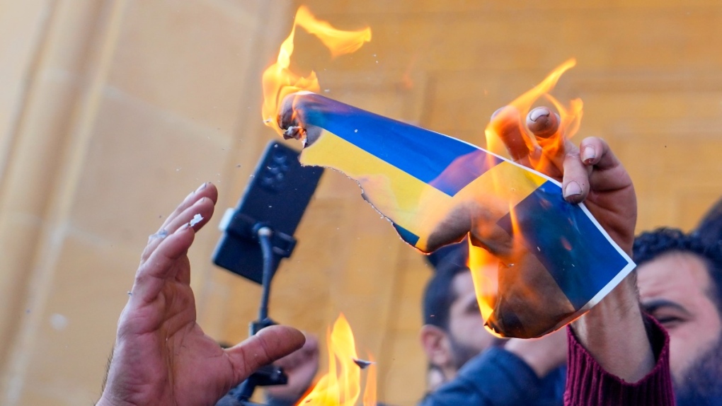 Protesters burn flags in Beirut, Lebanon