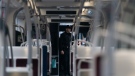 A Police officer stands inside a TTC streetcar on Spadina Ave., in Toronto on Tuesday, January 24, 2023. Police say a person was stabbed multiple times on a Toronto streetcar. They say the victim was sent to hospital and a suspect was arrested at the scene. THE CANADIAN PRESS/Arlyn McAdorey