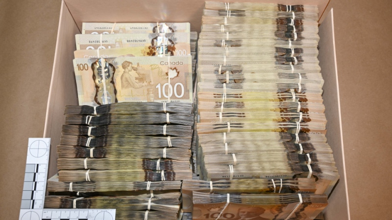 Police said in a news release on Jan. 27 they seized more than $800,000 in Canadian cash. (Supplied)