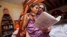 Ariana Birnbaum reads with her nine-year-old daughter Eden Brown as she puts her to bed in Toronto on Wednesday, July 25, 2012. (THE CANADIAN PRESS/Michelle Siu)