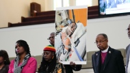 Family members and supporters hold a photograph of Tyre Nichols at a news conference in Memphis, Tenn., Jan. 23, 2023. The U.S. Attorney’s Office said Wednesday, Jan. 25, 2023