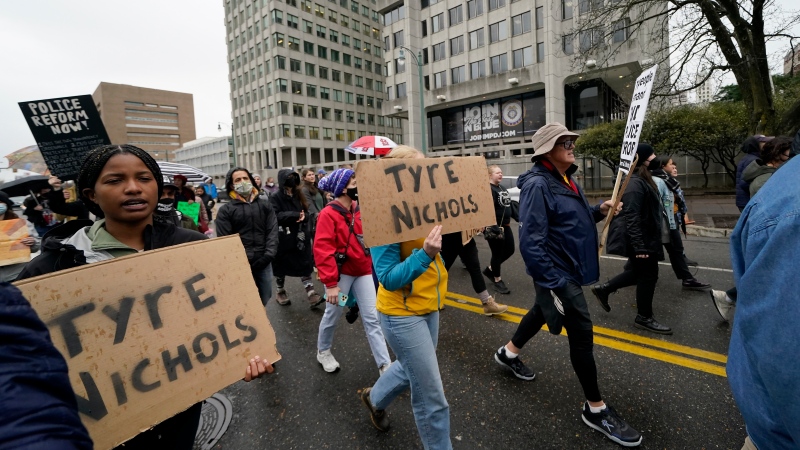 Protesters march in front of police headquarters on Jan. 28, 2023, in Memphis, Tenn., over the death of Tyre Nichols, who died after being beaten by Memphis police. (AP Photo/Gerald Herbert)