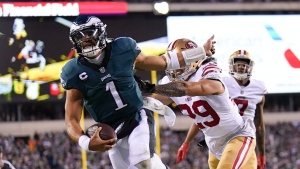 Philadelphia Eagles quarterback Jalen Hurts is pushed out of bounds by San Francisco 49ers safety Talanoa Hufanga during the NFC championship game, Jan. 29, 2023, in Philadelphia. (AP Photo/Matt Slocum)