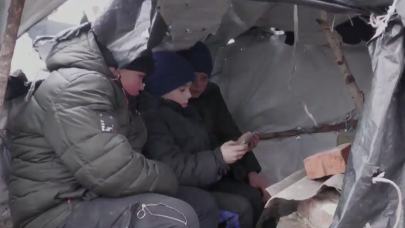 Ukrainian kids find cellphone signal on hill, set up makeshift school 
