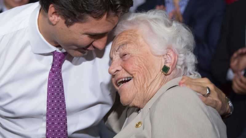 Liberal leader Justin Trudeau hugs former Mississauga mayor Hazel McCallion during a campaign event in a senior's home Friday, Oct. 16, 2015 in Mississauga, Ontario. McCallion, who led one of Canada’s largest cities into her 90′s, died Sunday morning, Jan. 29, 2023, leaving behind a legacy of feisty advocacy and more than three decades of nearly unchallenged leadership. She was 101. (Paul Chiasson/The Canadian Press via AP, File) 