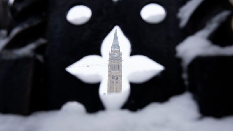 Snow covers a fence surrounding Parliament Hill, Jan. 20, 2023, in Ottawa. THE CANADIAN PRESS/Adrian Wyld