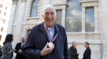 In this May 18, 2018 file photo, Canadian Jean Vanier, founder of L'Arche communities, poses for a photograph after he received the Templeton Prize at St Martins-in-the-Fields church in London. (AP Photo/Alastair Grant)