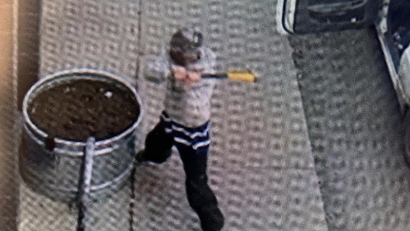 This photo provided by the Kelowna RCMP shows a suspect accused of smashing windows with an axe. 