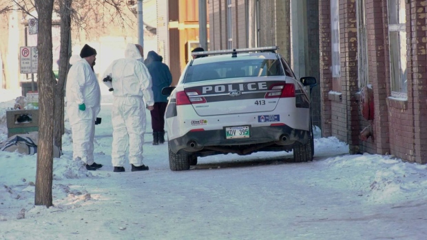 Forensic officers with the Winnipeg Police Service are stationed outside of the Manwin Hotel on Jan. 30, 2023. (Image source: Scott Andersson/CTV News Winnipeg)