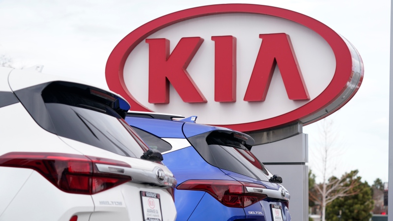 In this Sunday, Dec. 20, 2020, file photo the company sign stands over a row of unsold 2021 Seltos models at a Kia dealership, in Centennial, Colo. (AP Photo/David Zalubowski, File) 