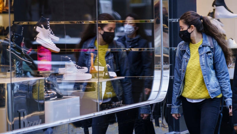 As inflation continues to weigh on Canadians' budgets, some may have entered the new year taking on a self-imposed "no-buy challenge." A woman does a bit of window shopping along Montreal’s Sainte-Catherine Street, on Tuesday, October 20, 2020. THE CANADIAN PRESS/Paul Chiasson