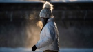A person exhales as they make their way along the Rideau Canal Skateway in Ottawa, on Saturday, Jan. 15, 2022. THE CANADIAN PRESS/Justin Tang