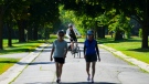 People make their way along Morningside Lane in Ottawa on Wednesday, July 13, 2022. THE CANADIAN PRESS/Sean Kilpatrick