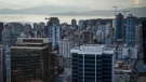 Home sales in Greater Vancouver are predicted to stay in line with last year’s slower pace, while prices will inch up slightly. Office towers, condos and apartment buildings are seen in downtown and the West End of Vancouver, on Thursday, Jan. 19, 2023. THE CANADIAN PRESS/Darryl Dyck