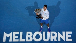 Novak Djokovic with the Norman Brookes Challenge Cup after his men's singles final win at the Australian Open, on Jan. 29, 2023. (Ng Han Guan / AP) 