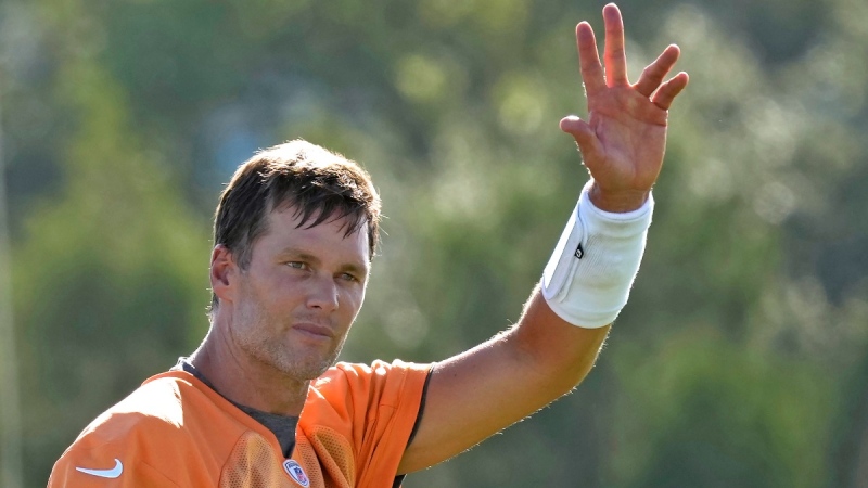 Tampa Bay Buccaneers quarterback Tom Brady waves to the fans during an NFL football training camp practice, on July 27, 2022. (Chris O'Meara / AP) 