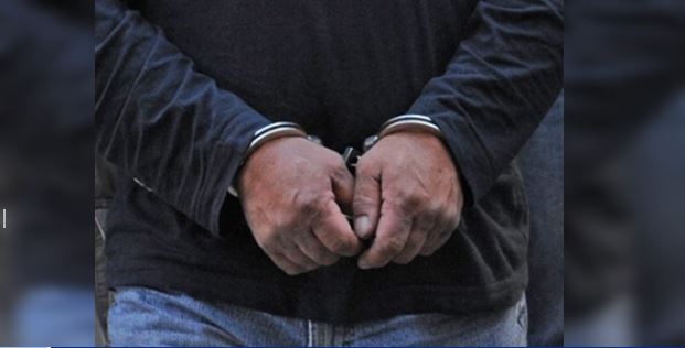 A man handcuffed in this file photo. 