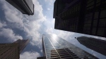 A report from an investor-focused advocacy group raises questions about how well some of Canada's biggest asset managers are meeting their climate commitments. Bank towers are shown from Bay Street in Toronto's financial district, on Wednesday, June 16, 2010. (THE CANADIAN PRESS/Adrien Veczan)
