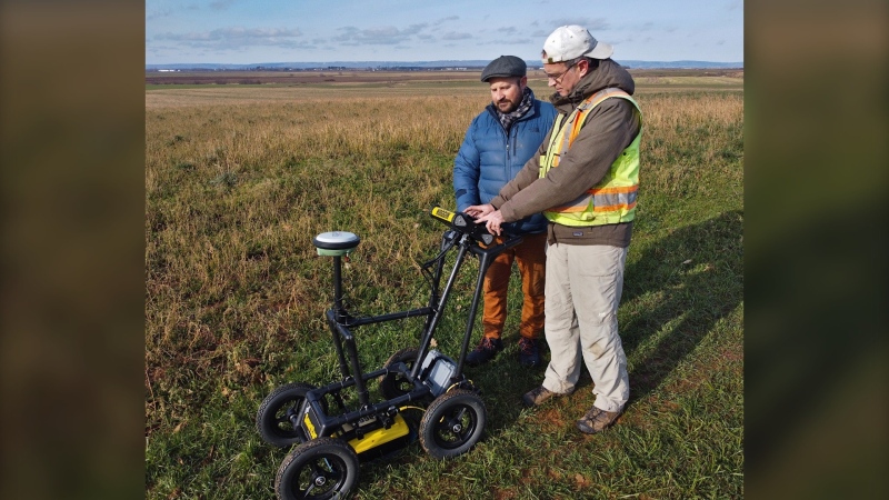 Saint Mary’s University professors Jonathan Fowler (right) and Aaron Taylor (left) work with ground penetrating radar in Grand-Pré, N.S., in December, 2022. A team from Saint Mary’s will work with the U.S. in France this summer in an attempt to find a missing crew member from a Second World War bomber. (THE CANADIAN PRESS/HO-Saint Mary’s University)