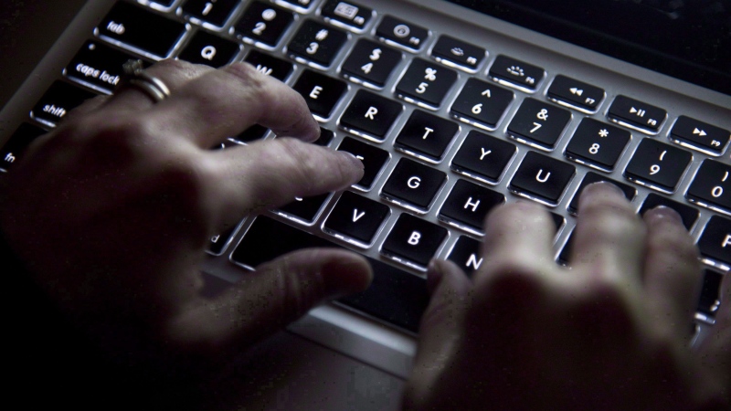A person is seen typing in a stock image. 