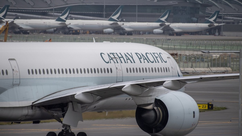 A Cathay Pacific airplane taxis at Hong Kong International Airport in Hong Kong on Nov. 25, 2022. Hong Kong will give away air tickets and vouchers to woo tourists back to the international financial hub, racing to catch up with other popular travel destinations in a fierce regional competition. (AP Photo/Vernon Yuen, File)