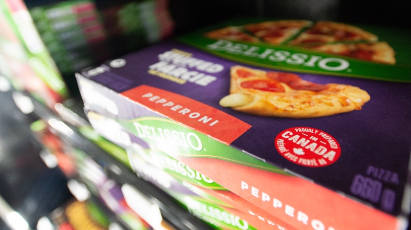 Delissio frozen pizzas are shown in the frozen food aisle at a grocery store in Toronto on Thursday, Feb. 2, 2023. THE CANADIAN PRESS/Joe O'Connal