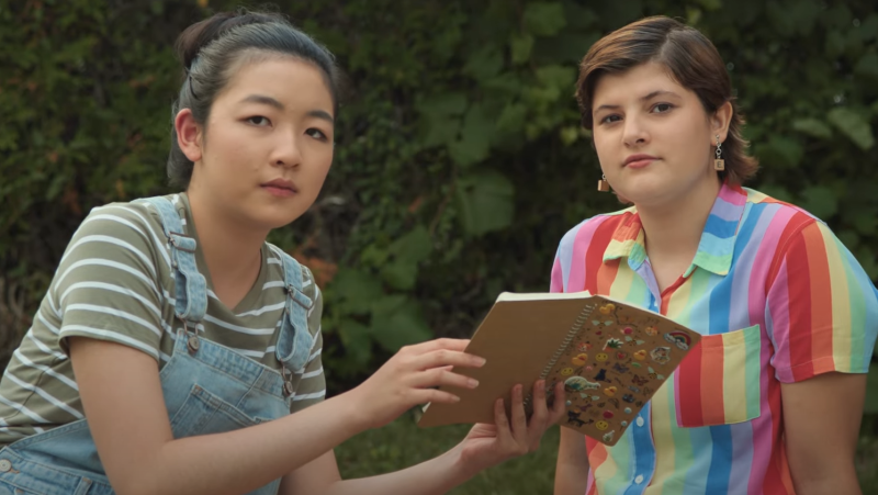 (Left) Jesyca Gu, who plays Liz, and Elliot Stocking, who plays Erin, in 'Erin's Guide to Kissing Girls'. A film focusing on the story of a young, queer middle schooler. (Screenshot)