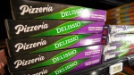 Delissio frozen pizzas are shown in the frozen food aisle at a grocery store in Toronto on Feb. 2, 2023. THE CANADIAN PRESS/Joe O'Connal